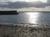 Polkerris harbour in the early evening sun