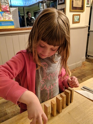 Laura playing with Jenga blocks