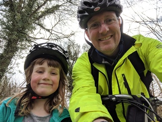 Daddy and Laura on bikes