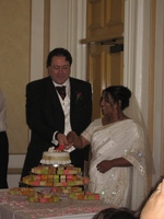 Frazer and Nalayini cut the cake