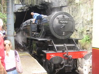 The steam train decouples from the carriages