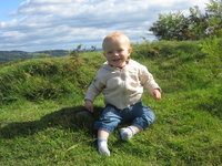 Matthew sitting on the grass