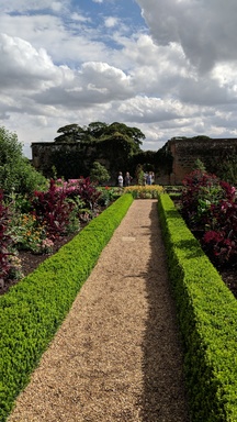 Walkway between flowerbeds