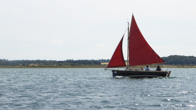 Red sailed boat