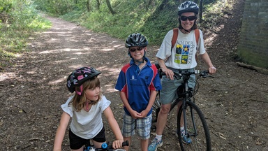 Children with bikes under the bridge